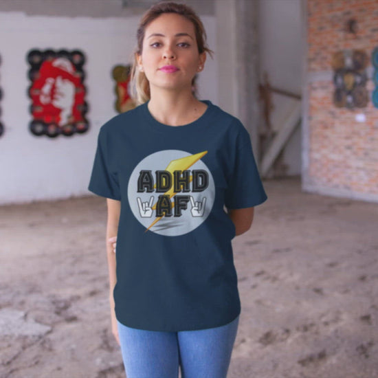 Video of a woman wearing a navy t-shirt that says adhd af