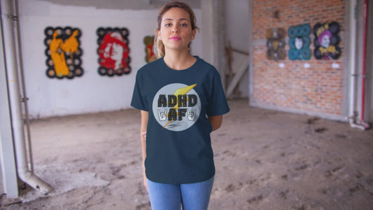 Video of a woman wearing a navy t-shirt that says adhd af